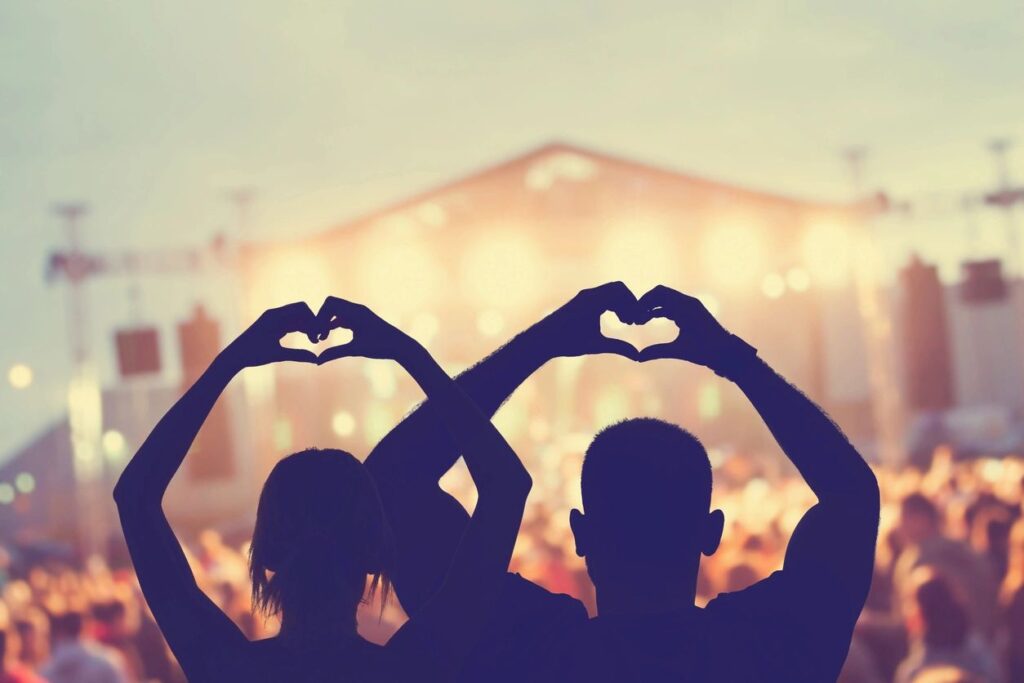People making hearts with their hands