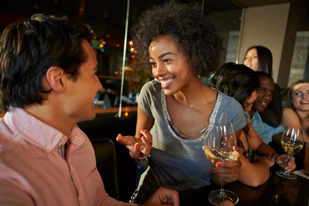 Couple talking at a party